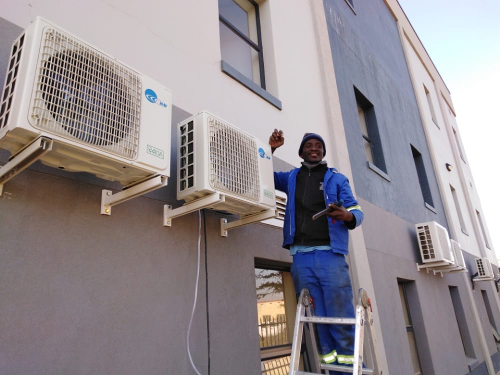 PNS ICE technicians installing air conditioners